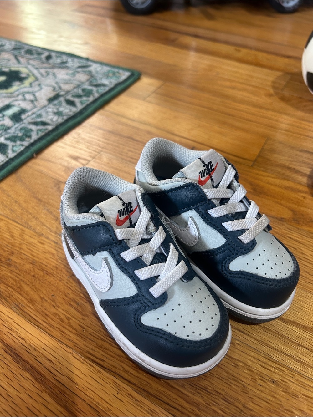 Nike Kids Low-Top Sneakers in Navy, Light Gray, and White